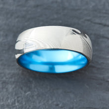 Load image into Gallery viewer, Wood Grain Damascus Steel Ring - Resilient Blue - EMBR
